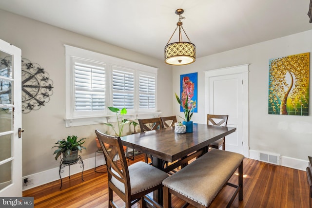 dining area featuring hardwood / wood-style floors