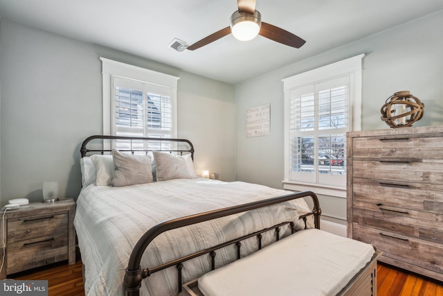 bedroom featuring dark wood-type flooring and ceiling fan