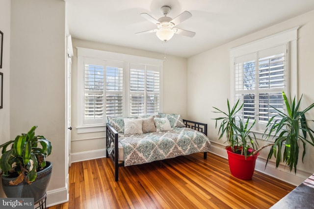 bedroom featuring hardwood / wood-style floors and ceiling fan