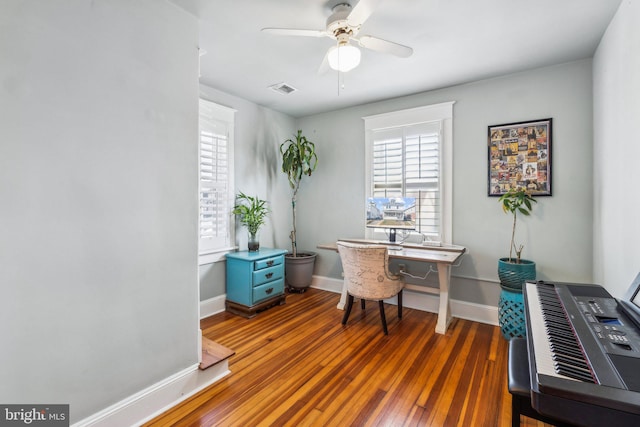 office featuring dark wood-type flooring and ceiling fan