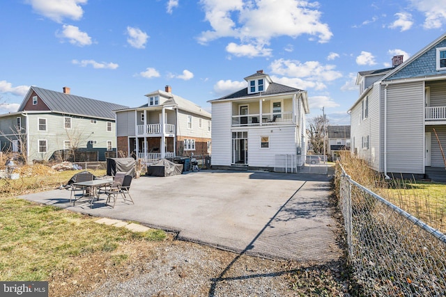 rear view of house featuring a patio area