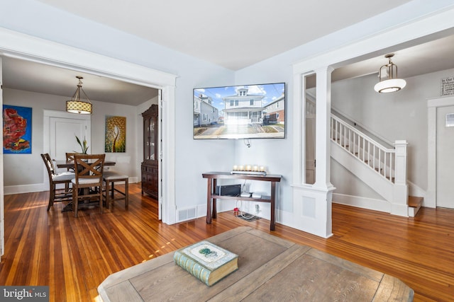 living room with dark hardwood / wood-style flooring