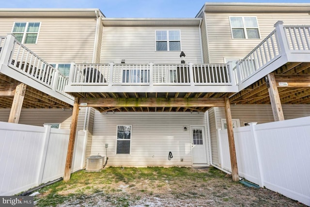 back of property with central AC unit