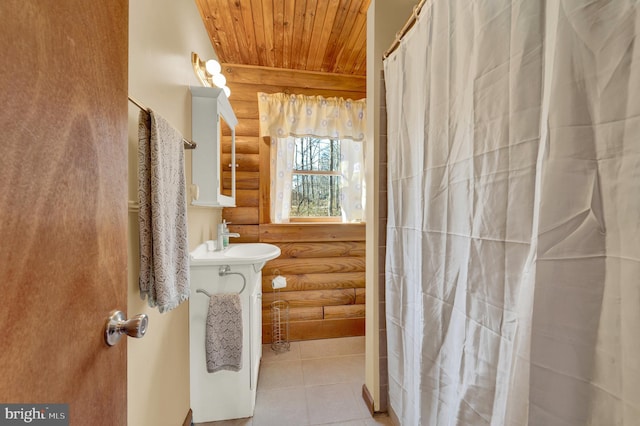 bathroom featuring a sink, wood ceiling, tile patterned flooring, and a shower with shower curtain