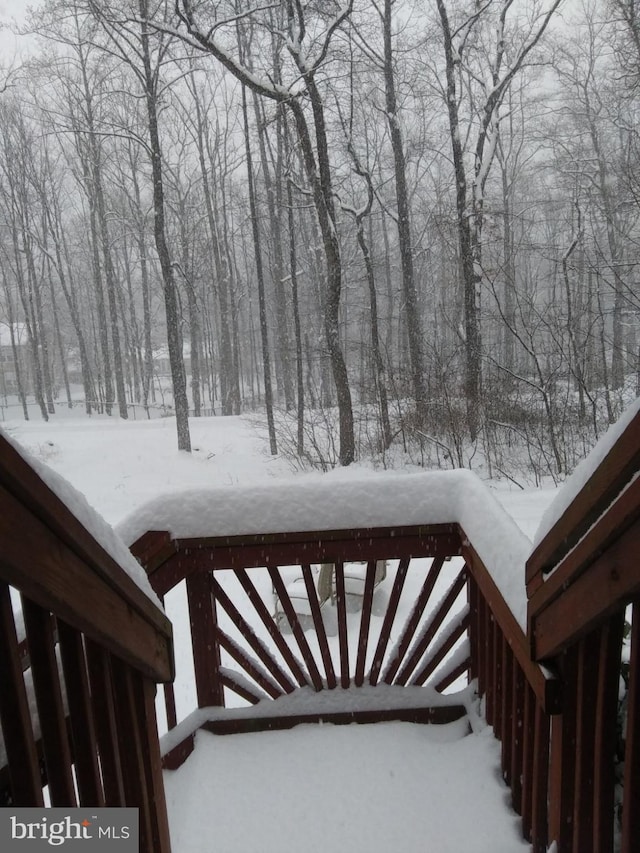 view of snow covered deck