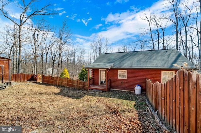 view of side of home with a fenced backyard