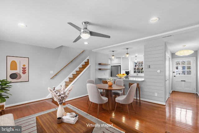 dining space with hardwood / wood-style floors