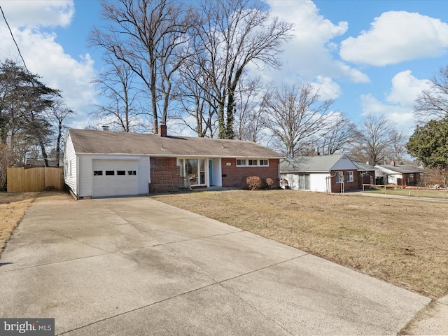 view of front of home featuring a garage and a front lawn