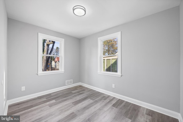 unfurnished room featuring light wood-type flooring