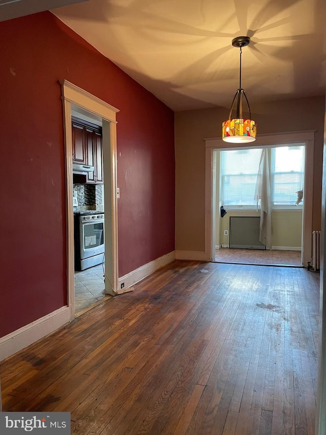 unfurnished dining area with hardwood / wood-style flooring