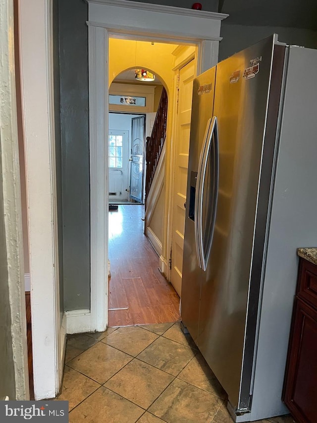 corridor with tile patterned flooring