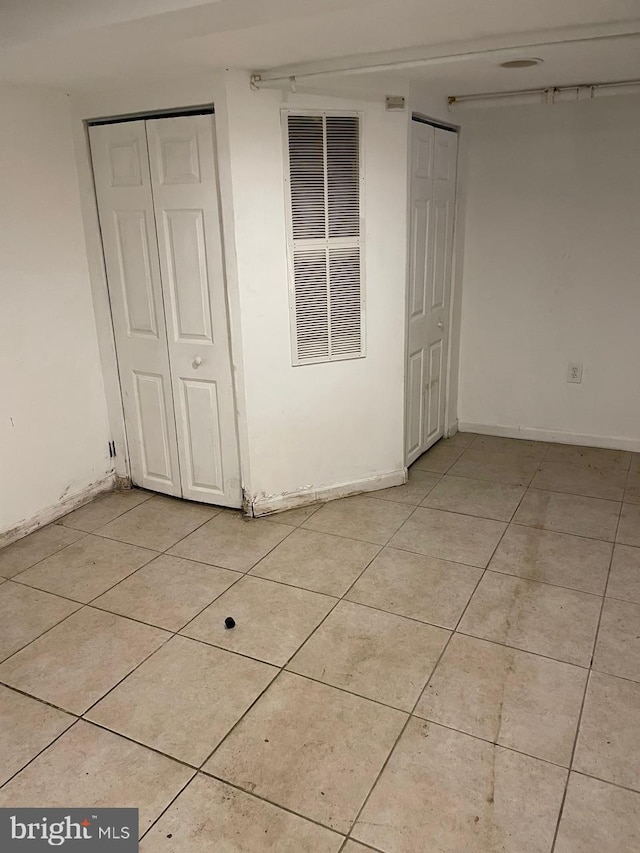 unfurnished bedroom featuring light tile patterned floors