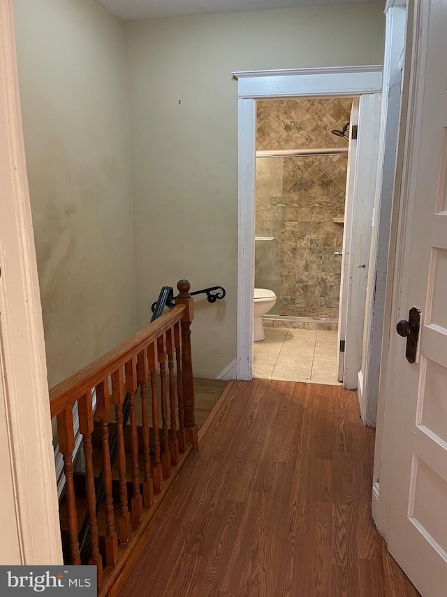 corridor with light hardwood / wood-style flooring