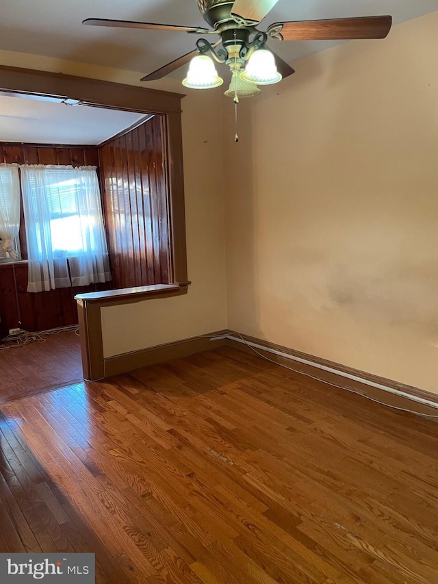 unfurnished room with hardwood / wood-style flooring and ceiling fan