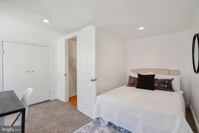 carpeted bedroom featuring a closet