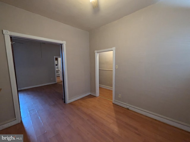 spare room with hardwood / wood-style floors