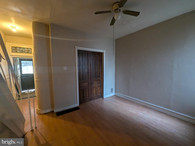 interior space with hardwood / wood-style flooring and ceiling fan