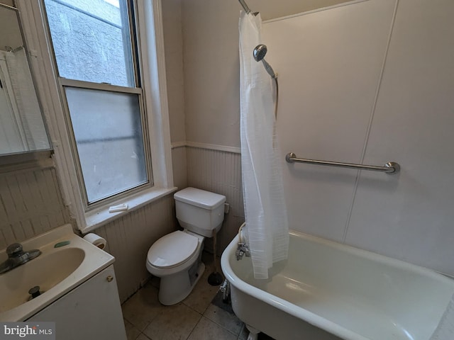 full bathroom with tile patterned flooring, vanity, shower / bath combo, and toilet