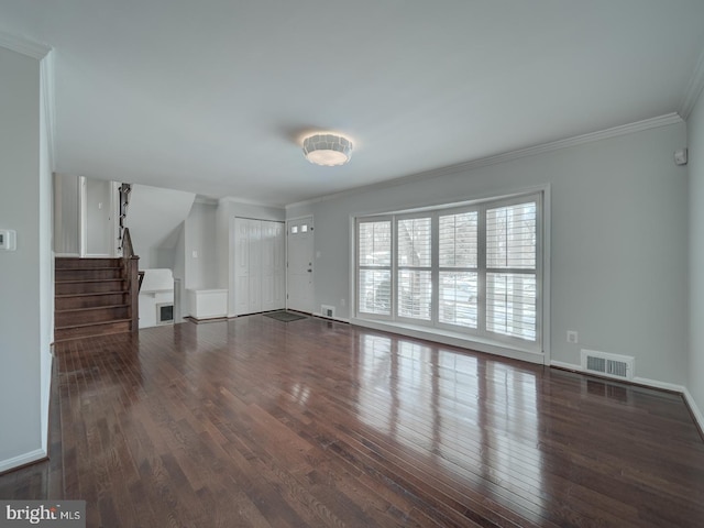 unfurnished living room with crown molding and dark hardwood / wood-style floors