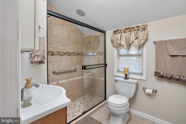 bathroom featuring a shower with door, sink, tile patterned flooring, and toilet