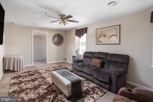 living room featuring carpet and ceiling fan