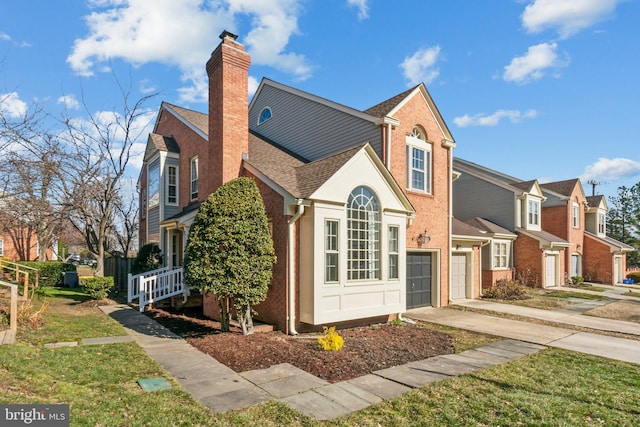 view of side of home with a garage and a lawn