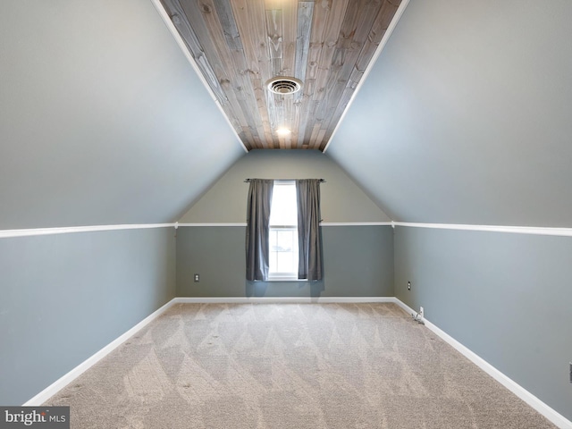 bonus room with lofted ceiling, carpet flooring, visible vents, and baseboards