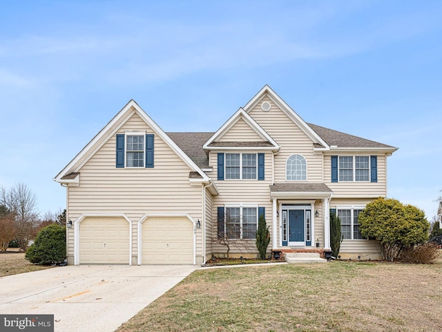 traditional home featuring a garage, concrete driveway, a shingled roof, and a front lawn