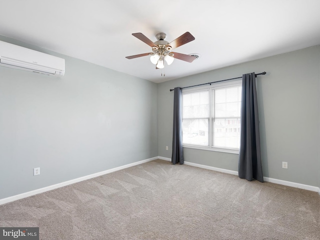 spare room with baseboards, light colored carpet, a ceiling fan, and a wall mounted air conditioner