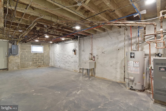 basement with gas water heater and electric panel