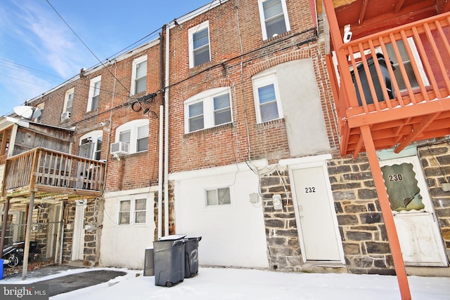 snow covered property featuring cooling unit