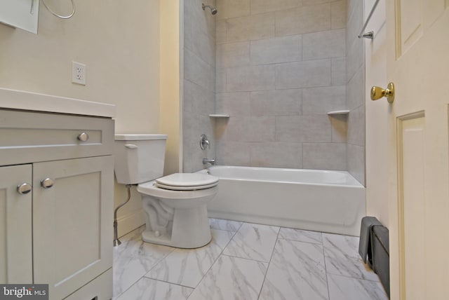 full bathroom featuring tiled shower / bath combo, vanity, and toilet