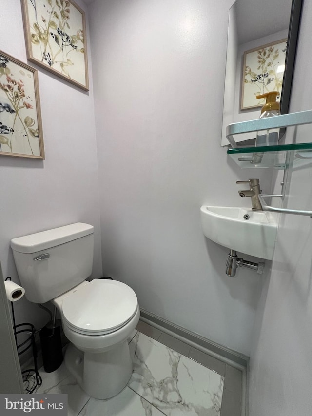 bathroom with toilet and sink