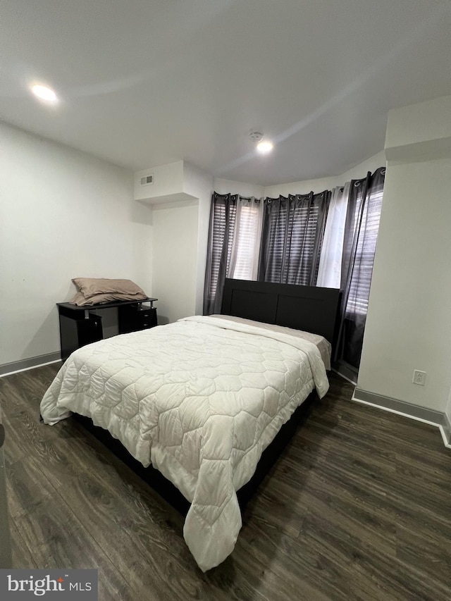 bedroom featuring dark hardwood / wood-style flooring