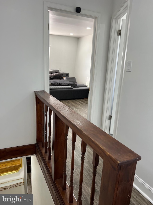 hallway with wood-type flooring