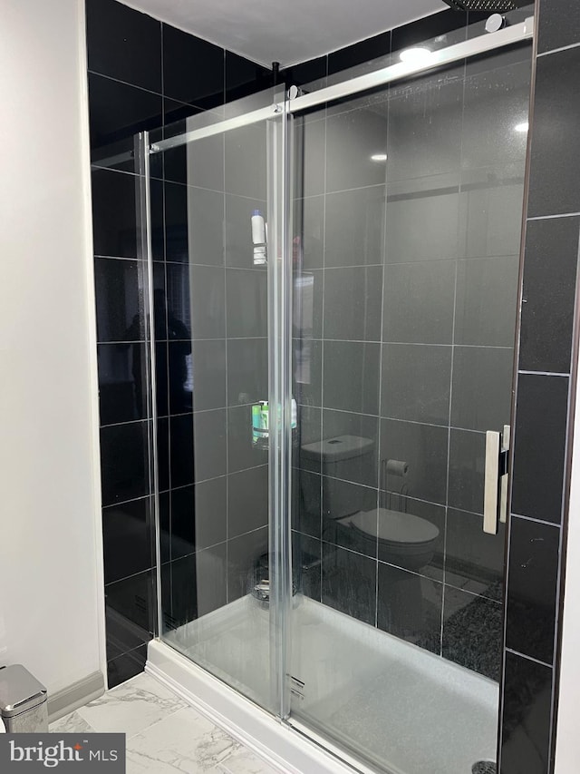 bathroom with a shower with shower door