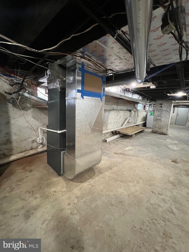 basement featuring heating unit