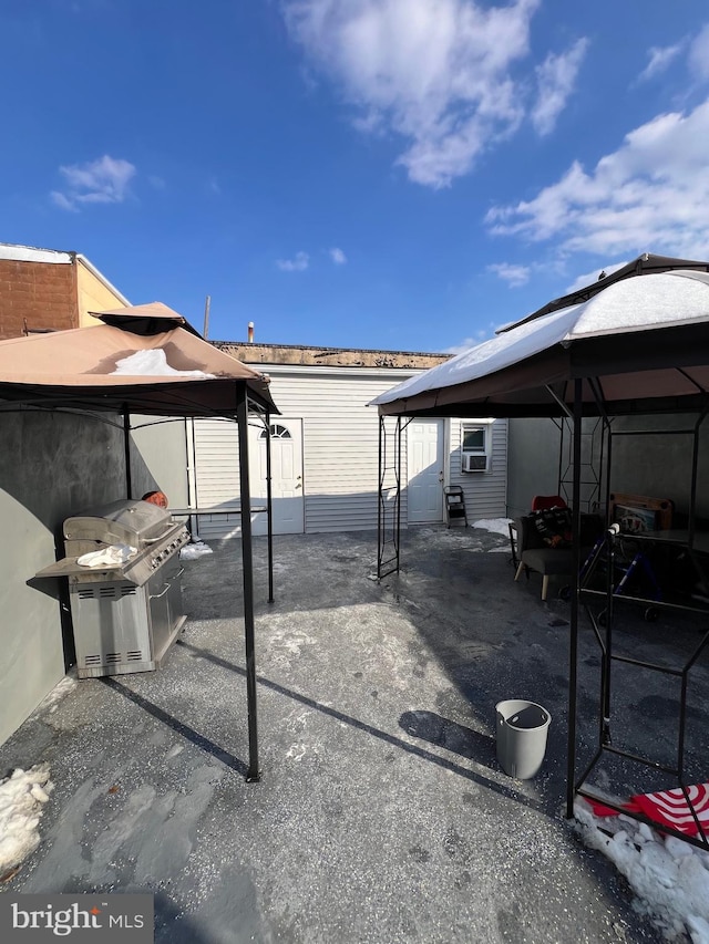 view of patio featuring a gazebo and cooling unit