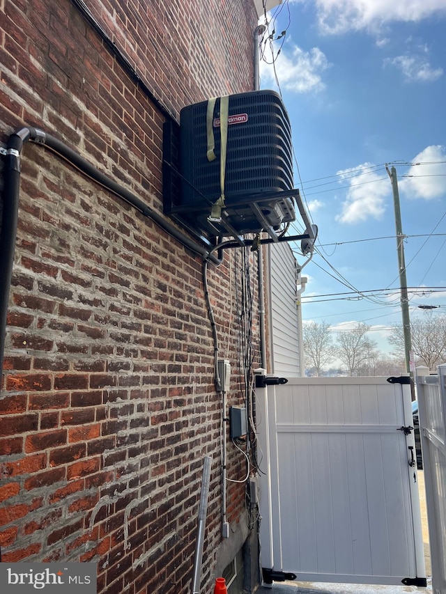 view of side of property with cooling unit