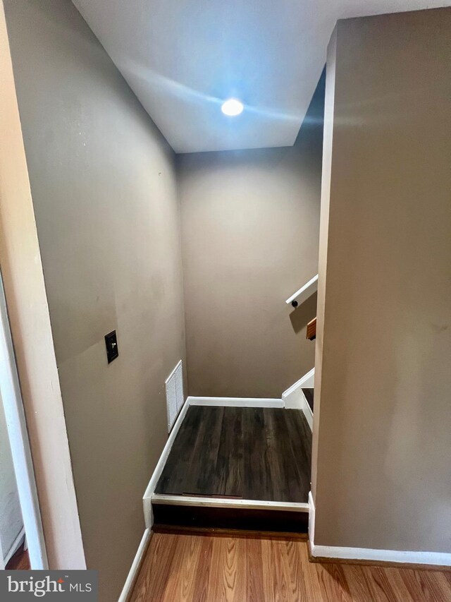 398 Harry S Truman Dr, Upper Marlboro, MD 20774 - stairway featuring wood finished floors and baseboards