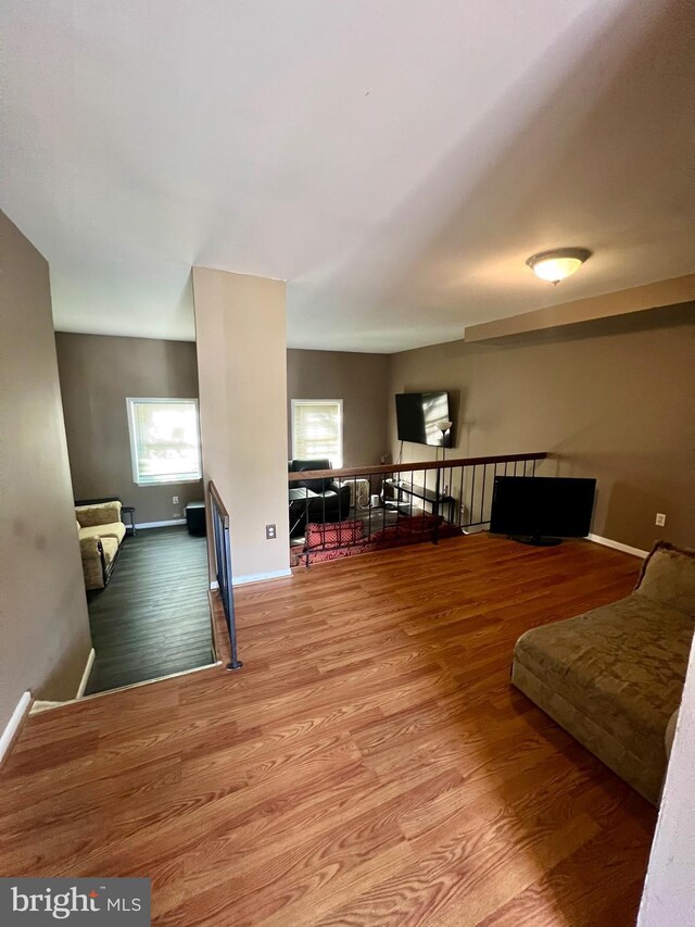 398 Harry S Truman Dr, Upper Marlboro, MD 20774 - living room featuring wood finished floors and baseboards