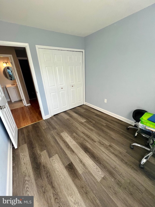 398 Harry S Truman Dr, Upper Marlboro, MD 20774 - unfurnished bedroom featuring wood finished floors, a closet, and baseboards