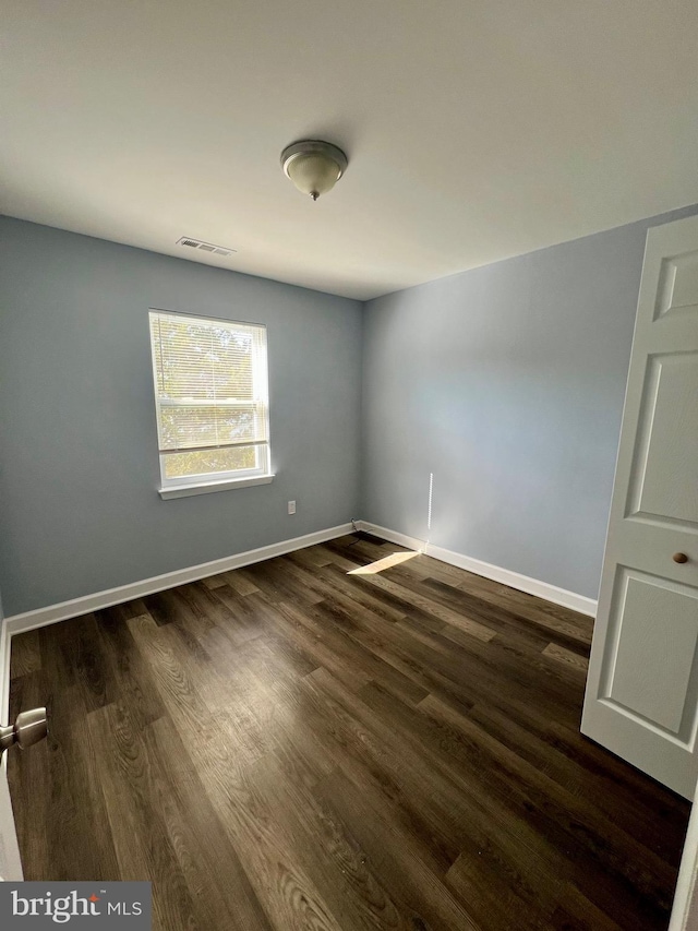 398 Harry S Truman Dr, Upper Marlboro, MD 20774 - spare room with dark wood-style flooring and baseboards