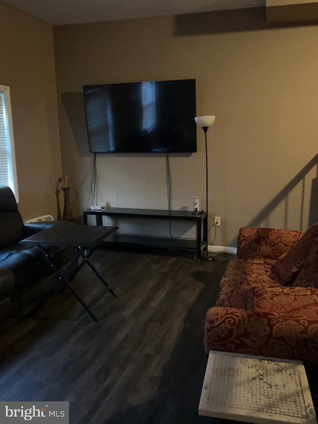 unfurnished living room featuring hardwood / wood-style floors