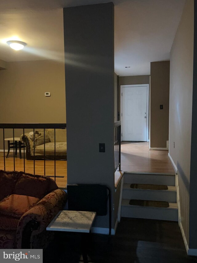 398 Harry S Truman Dr, Upper Marlboro, MD 20774 - staircase with baseboards and wood finished floors