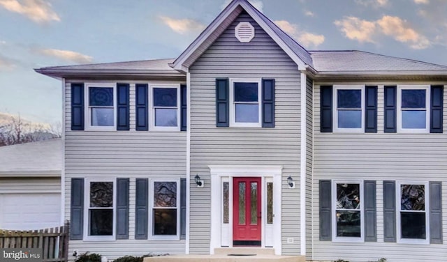 view of front of property with a garage