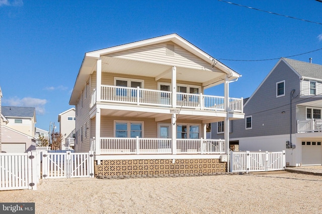 view of front of property featuring a porch and a balcony