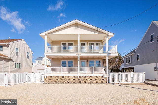 view of front of home featuring a porch and a balcony