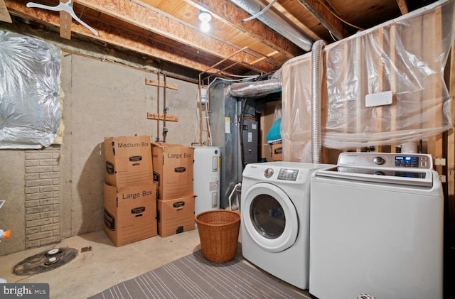 laundry area with separate washer and dryer and water heater