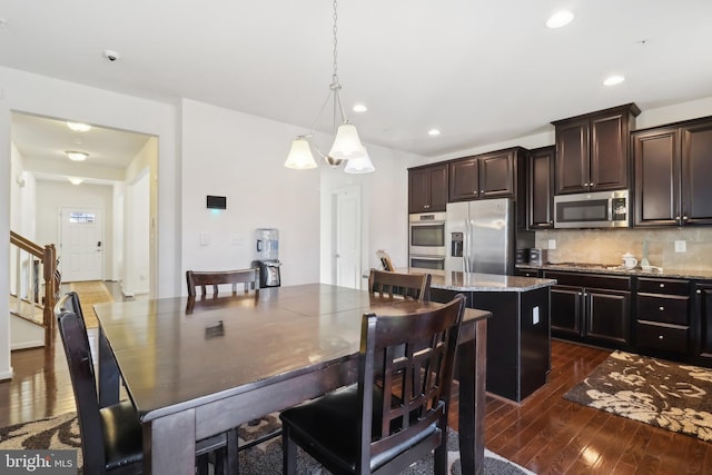 dining room with dark hardwood / wood-style floors